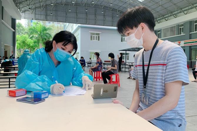 Students being screened before the vaccination.